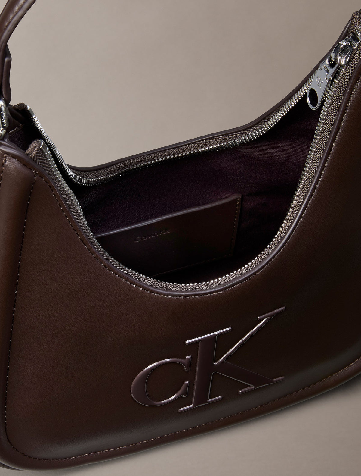 Embossed Monogram Crescent Bag