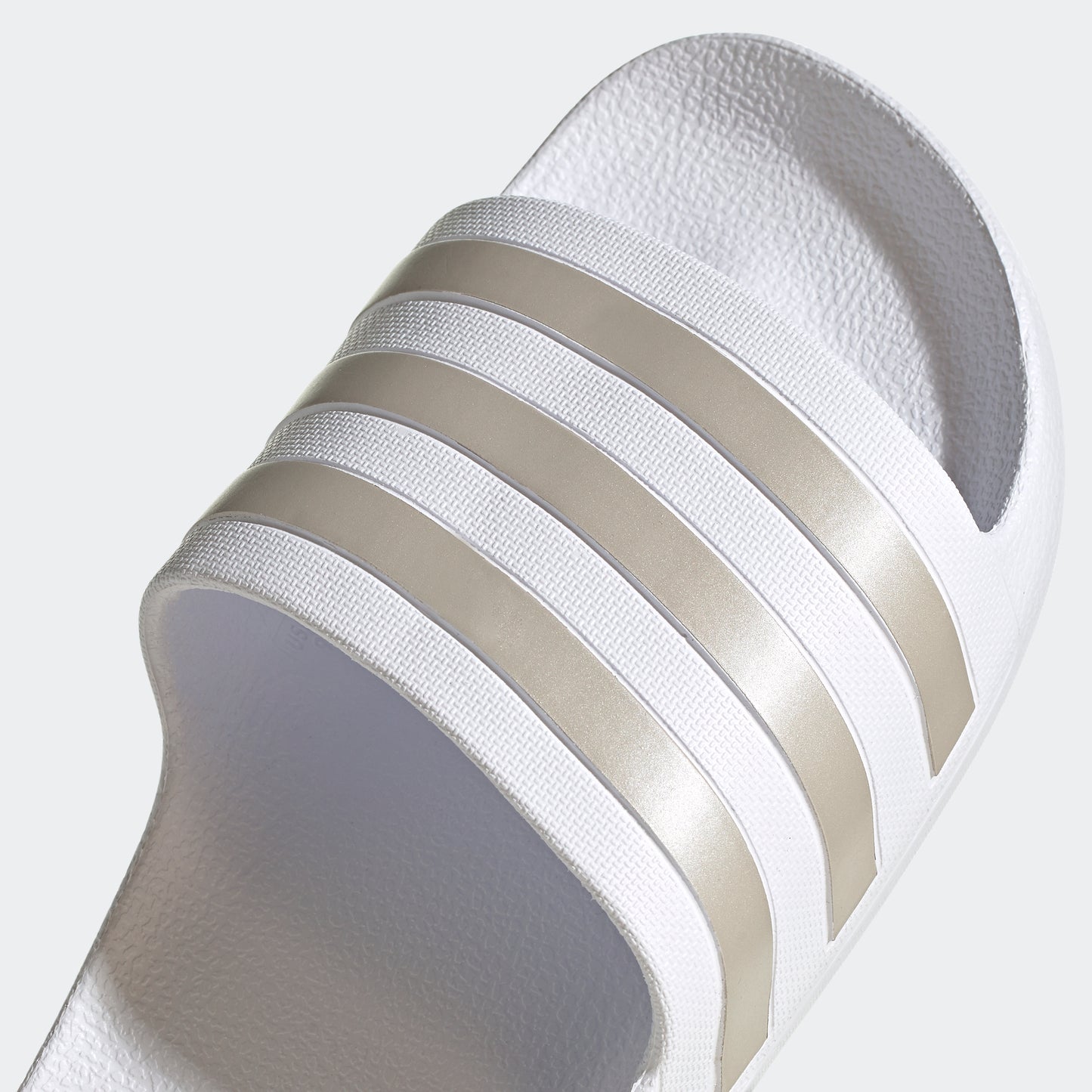 Adilette Aqua Slides (White / Platinum Metallic)